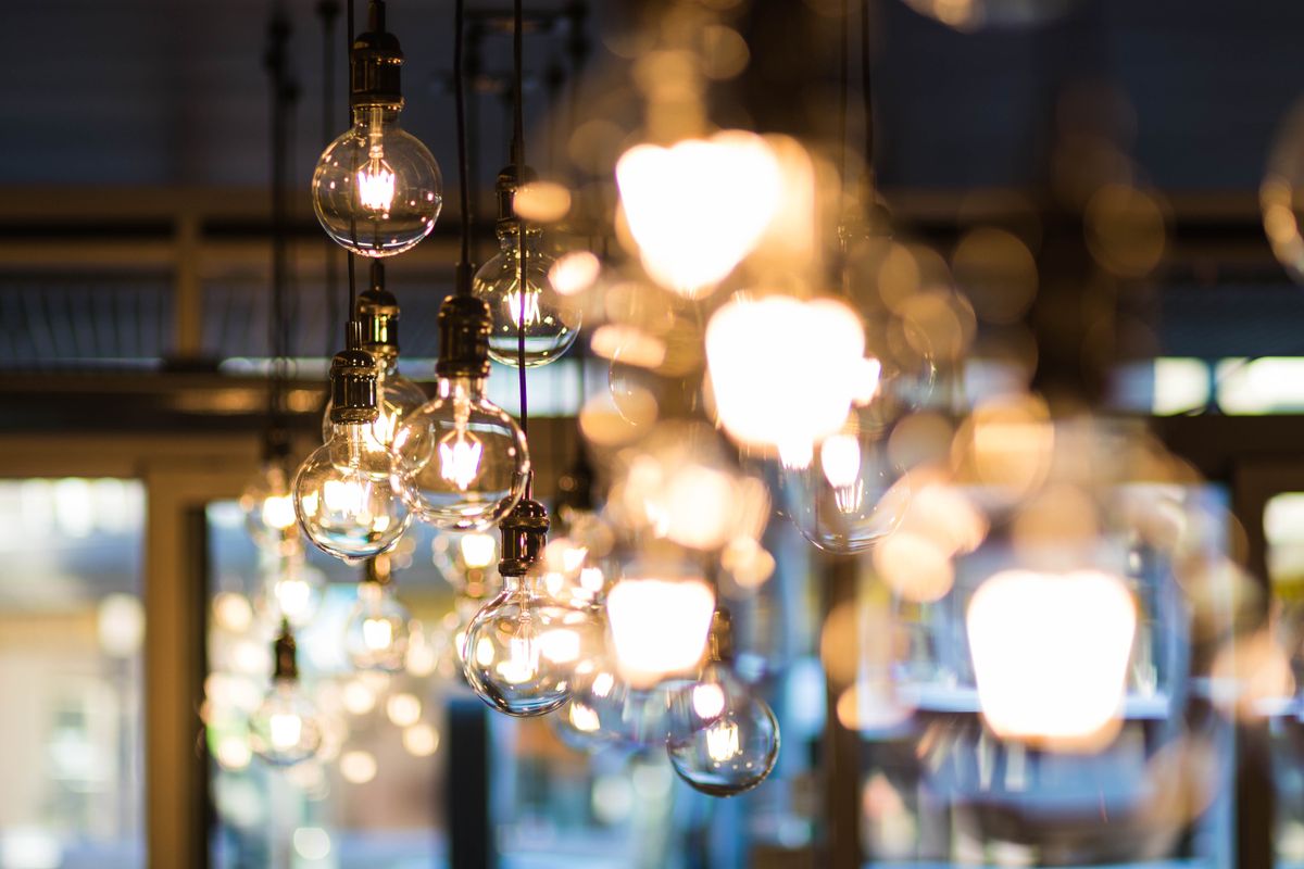 Warm bulb lights strung across the fellowship hall