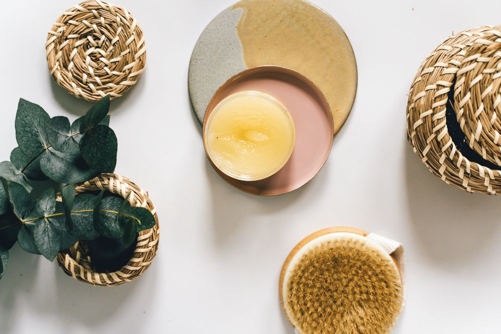 Natural skincare products beside eucalyptus