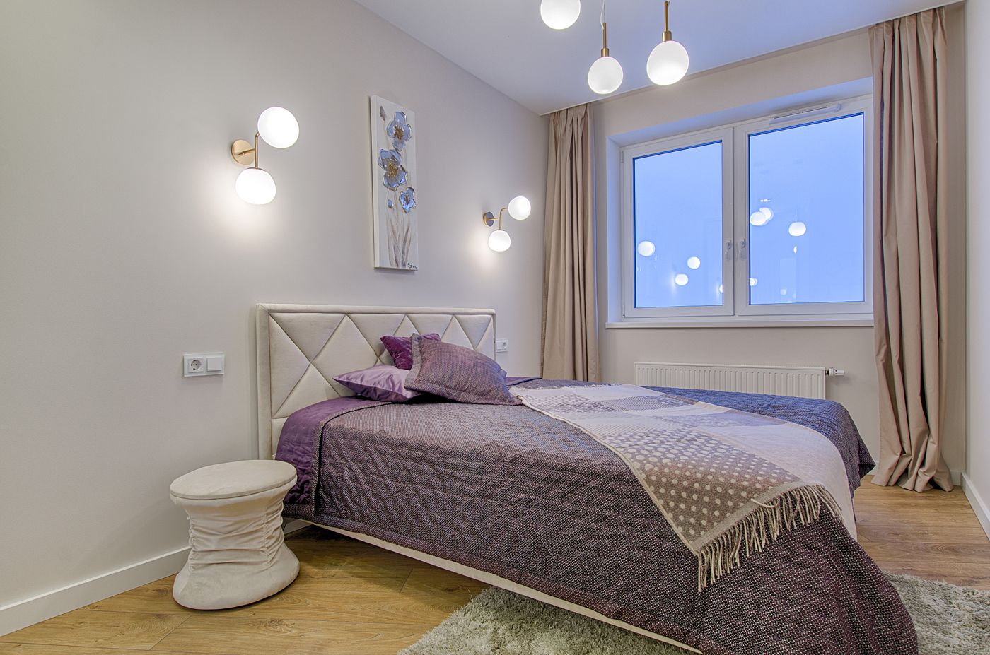 A quiet plum-toned room in the inn upstairs